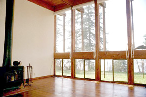 Living room with 12ft. ceiling and wood stove